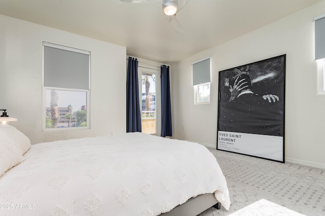 706 E Washington St Unit 124, Phoenix, AZ 85034 - carpeted bedroom with a ceiling fan and baseboards