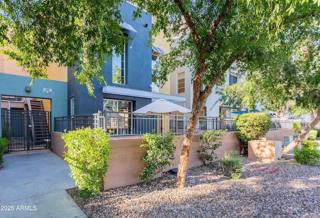706 E Washington St Unit 124, Phoenix, AZ 85034 - view of front of property featuring a gate and stucco siding