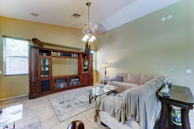 7815 S 22nd Ln, Phoenix, AZ 85041 - living room with ceiling fan, carpet, and baseboards