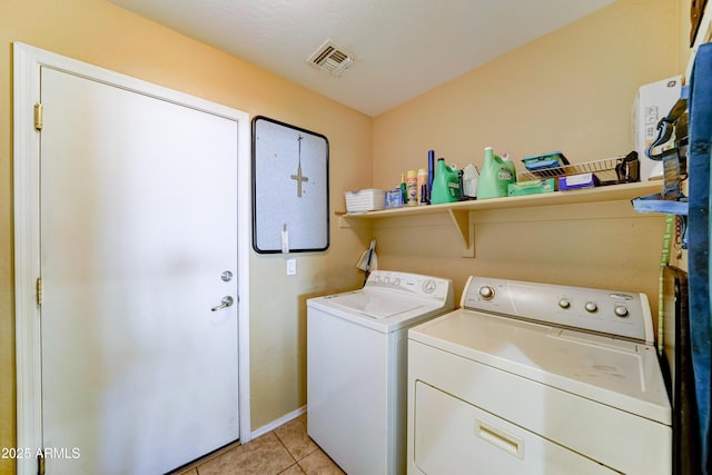 7815 S 22nd Ln, Phoenix, AZ 85041 - laundry area with washer and clothes dryer and light tile patterned floors