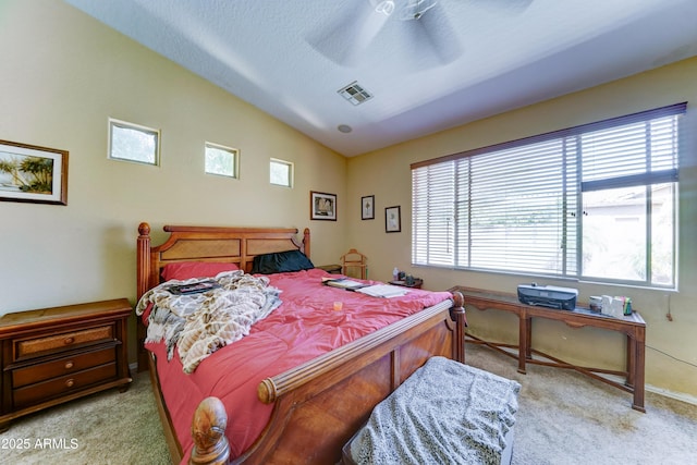 7815 S 22nd Ln, Phoenix, AZ 85041 - bedroom featuring light colored carpet, vaulted ceiling, and a ceiling fan