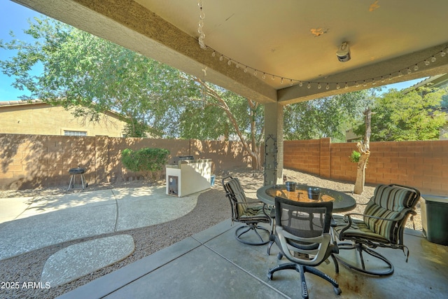 7815 S 22nd Ln, Phoenix, AZ 85041 - view of patio / terrace with a fenced backyard and outdoor dining space