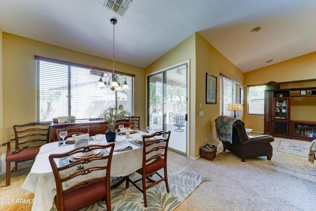 7815 S 22nd Ln, Phoenix, AZ 85041 - carpeted dining space with vaulted ceiling, a chandelier, and baseboards