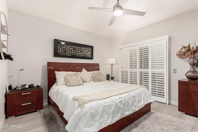 bedroom featuring access to outside, baseboards, ceiling fan, and light wood finished floors