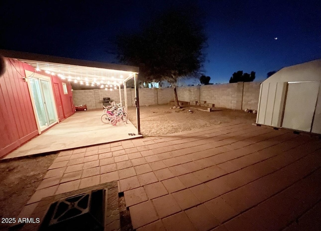 view of patio at twilight