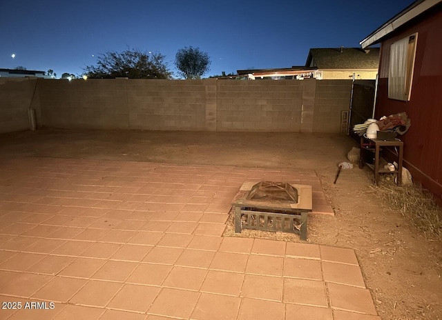 view of patio / terrace with an outdoor fire pit