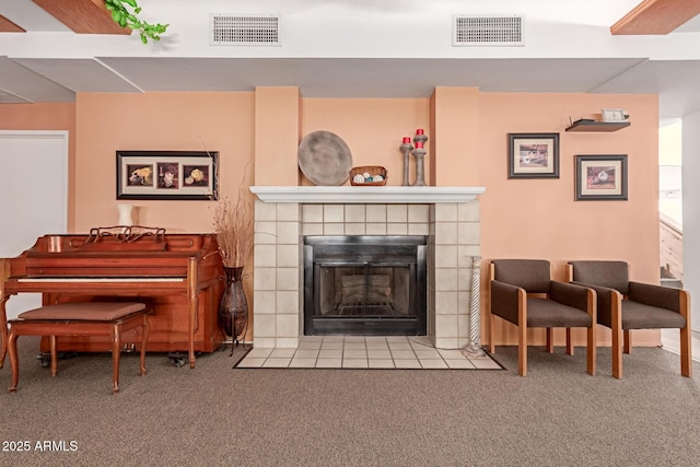 living room featuring light colored carpet and a fireplace