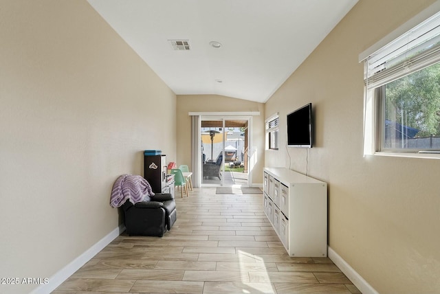 corridor with lofted ceiling