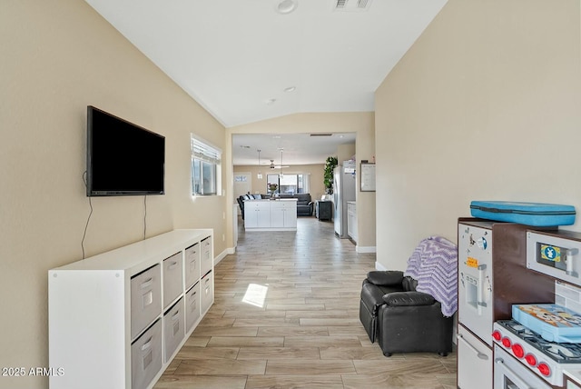 corridor featuring lofted ceiling