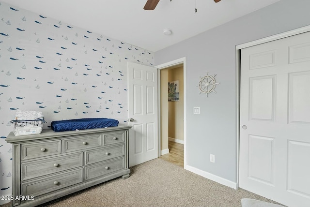 carpeted bedroom with ceiling fan