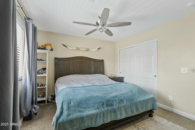 bedroom with light carpet and ceiling fan