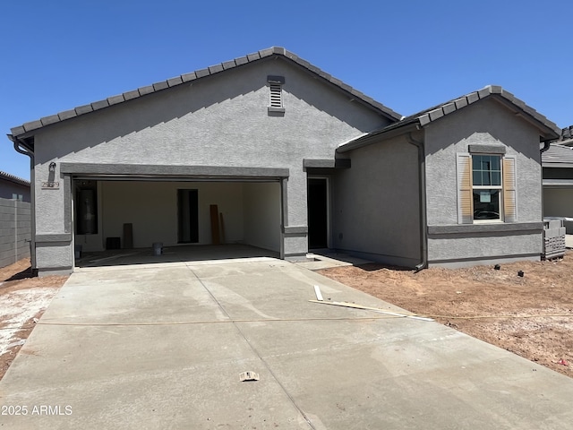 29679 N Oak Dr, Florence, AZ 85132 - view of front of property with a garage, driveway, and stucco siding