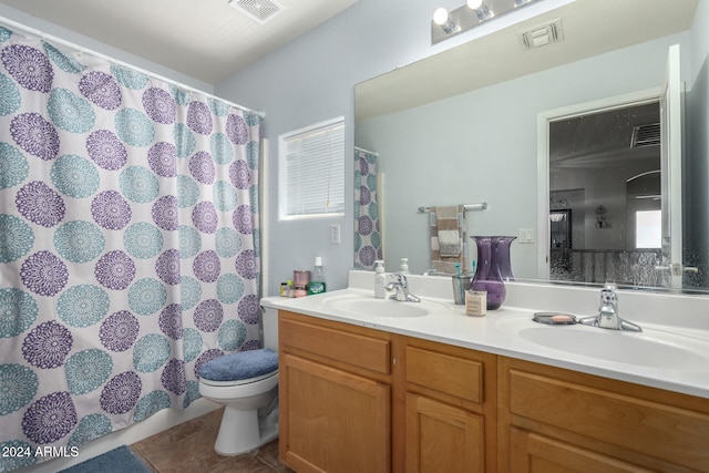 bathroom featuring toilet, tile patterned flooring, vanity, and a shower with curtain