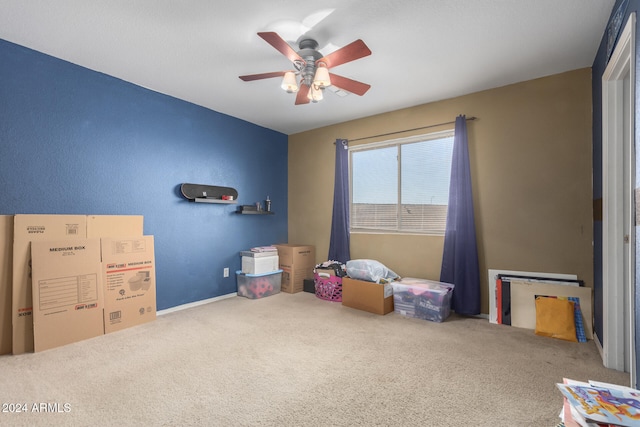 rec room featuring ceiling fan and carpet floors