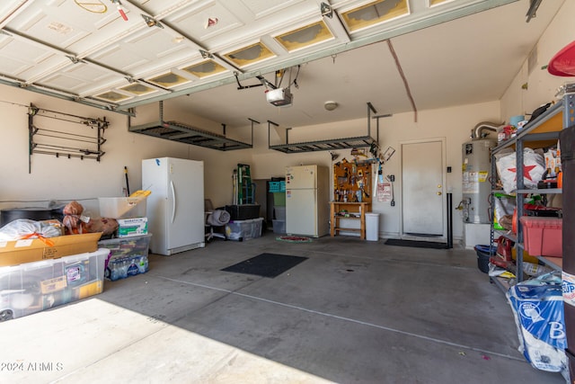 garage featuring a garage door opener, white fridge, and gas water heater