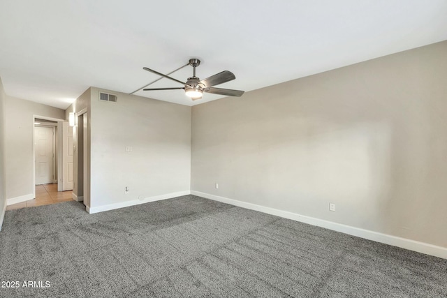 unfurnished room featuring light carpet and ceiling fan