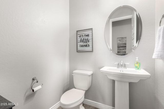 bathroom with sink and toilet