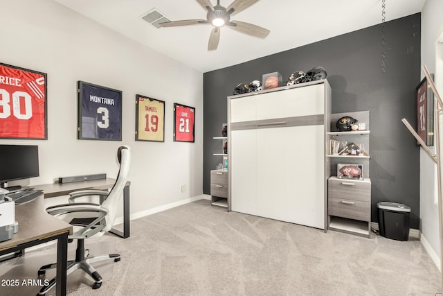 carpeted office with ceiling fan