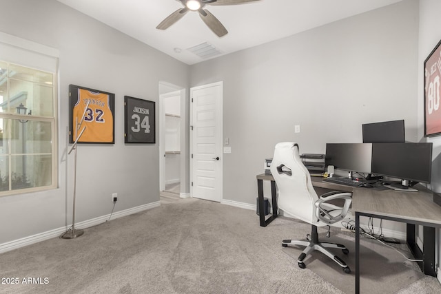 carpeted home office with ceiling fan