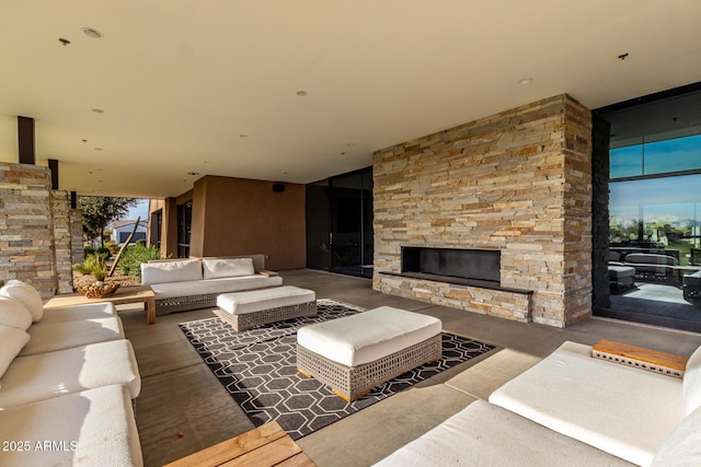 view of patio featuring an outdoor living space with a fireplace