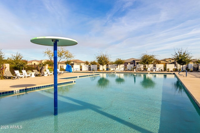 view of swimming pool with a patio area