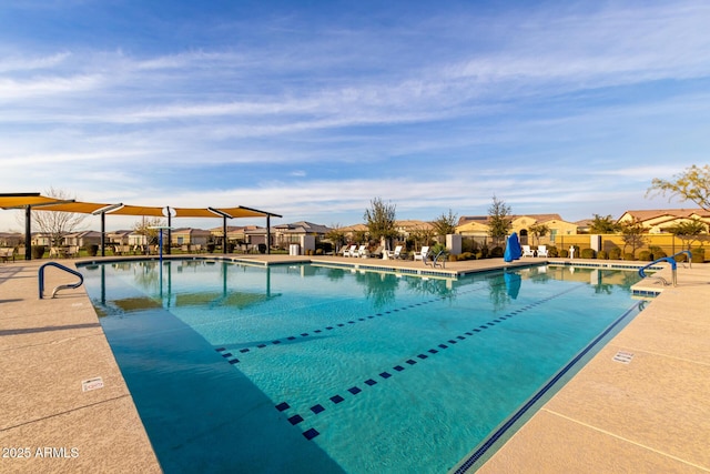 view of swimming pool featuring a patio area