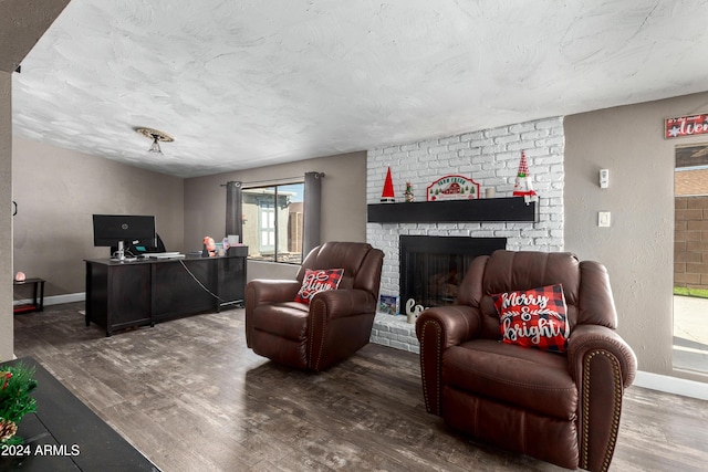 living room featuring a fireplace and hardwood / wood-style floors