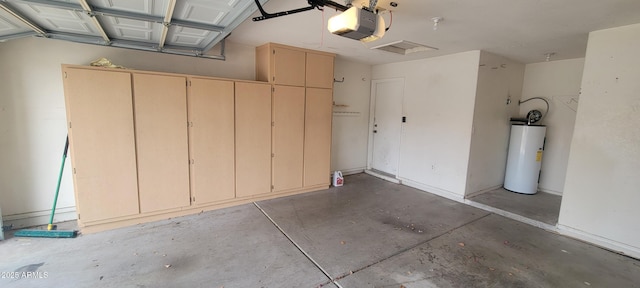 garage with water heater and a garage door opener