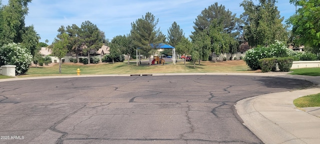 view of road featuring curbs and sidewalks