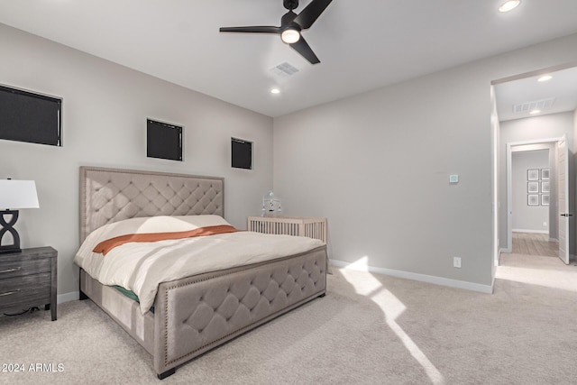 bedroom featuring ceiling fan and light carpet