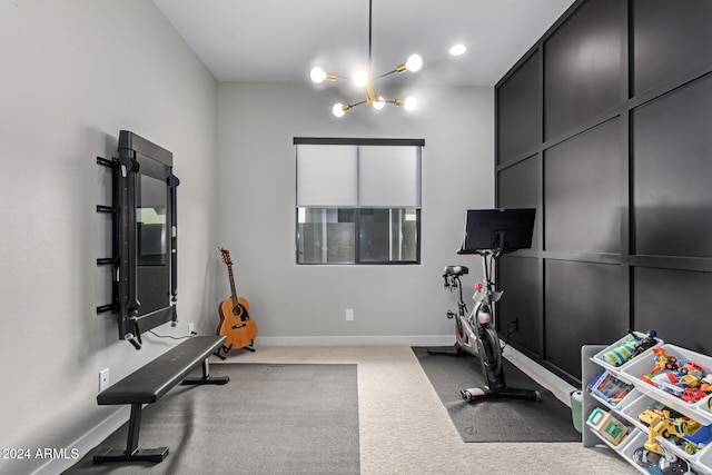 workout room with carpet flooring and a chandelier