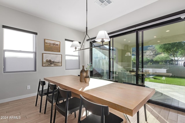 dining area featuring a chandelier and a wealth of natural light