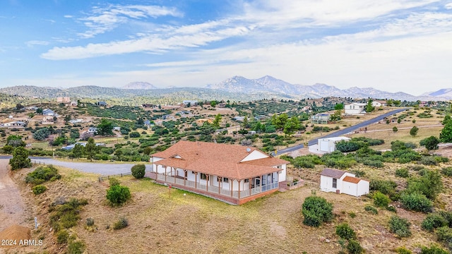 birds eye view of property with a mountain view