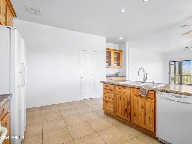 kitchen with white appliances, light tile patterned floors, visible vents, recessed lighting, and a sink