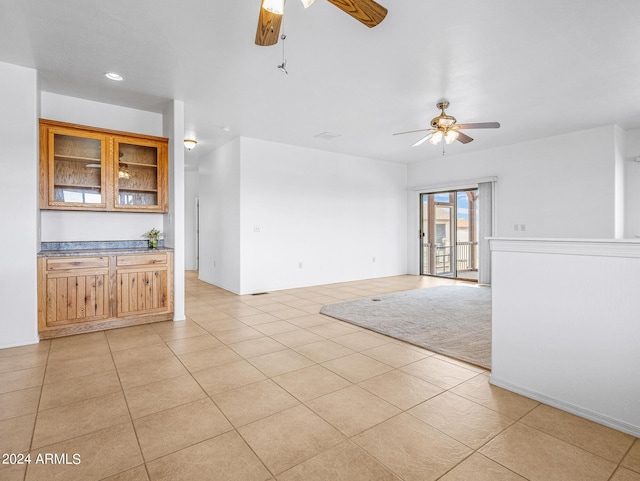 empty room with recessed lighting, light tile patterned floors, a ceiling fan, and visible vents