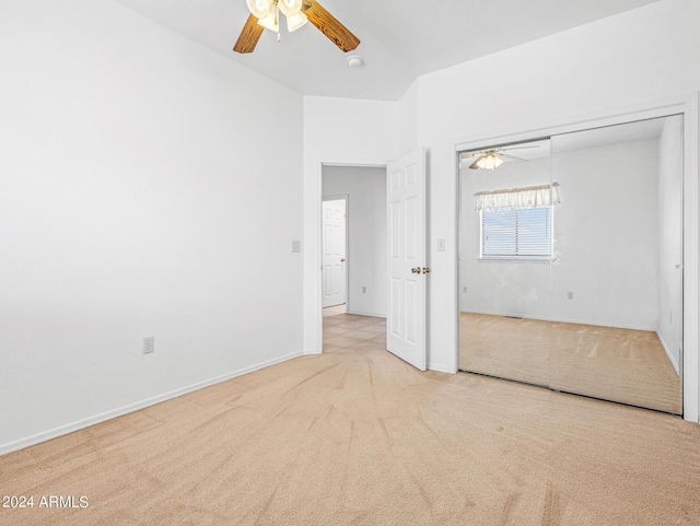 unfurnished bedroom featuring a closet, baseboards, ceiling fan, and carpet flooring