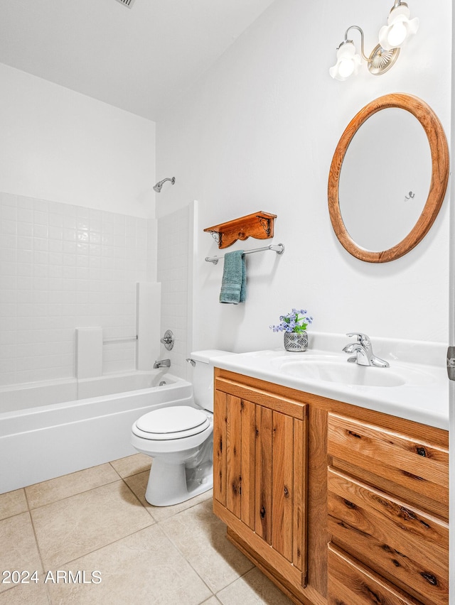 bathroom with tile patterned floors, shower / bathing tub combination, toilet, and vanity