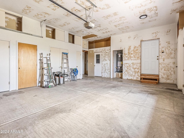 garage with a garage door opener and water heater