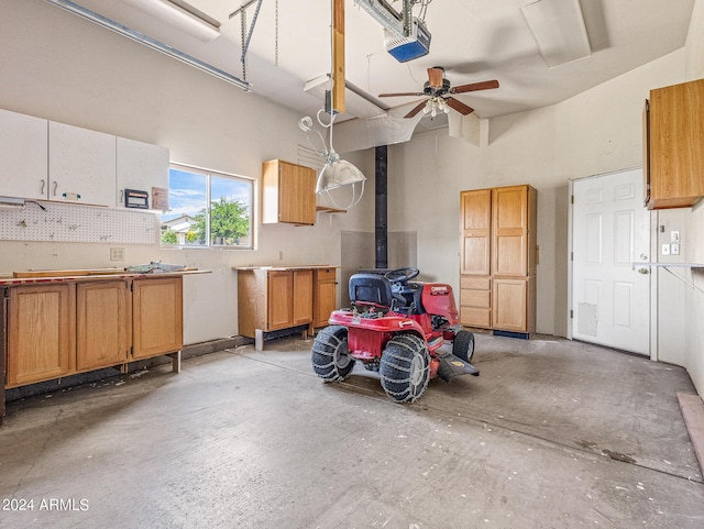 garage featuring a workshop area and a garage door opener