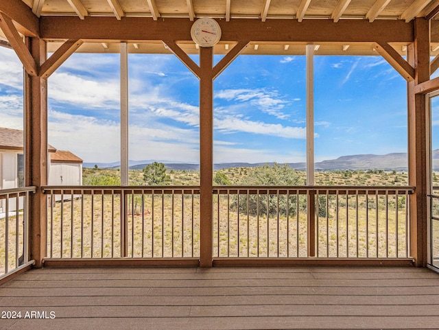 wooden deck featuring a mountain view