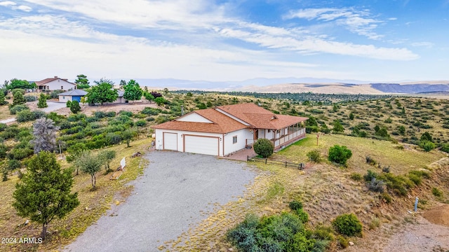 birds eye view of property featuring a mountain view