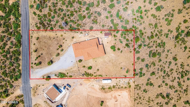 birds eye view of property featuring a desert view