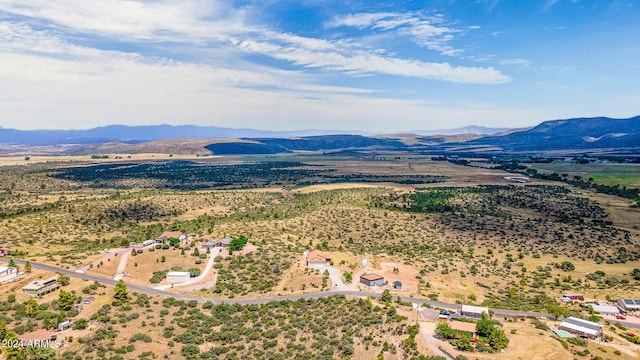 birds eye view of property with a mountain view