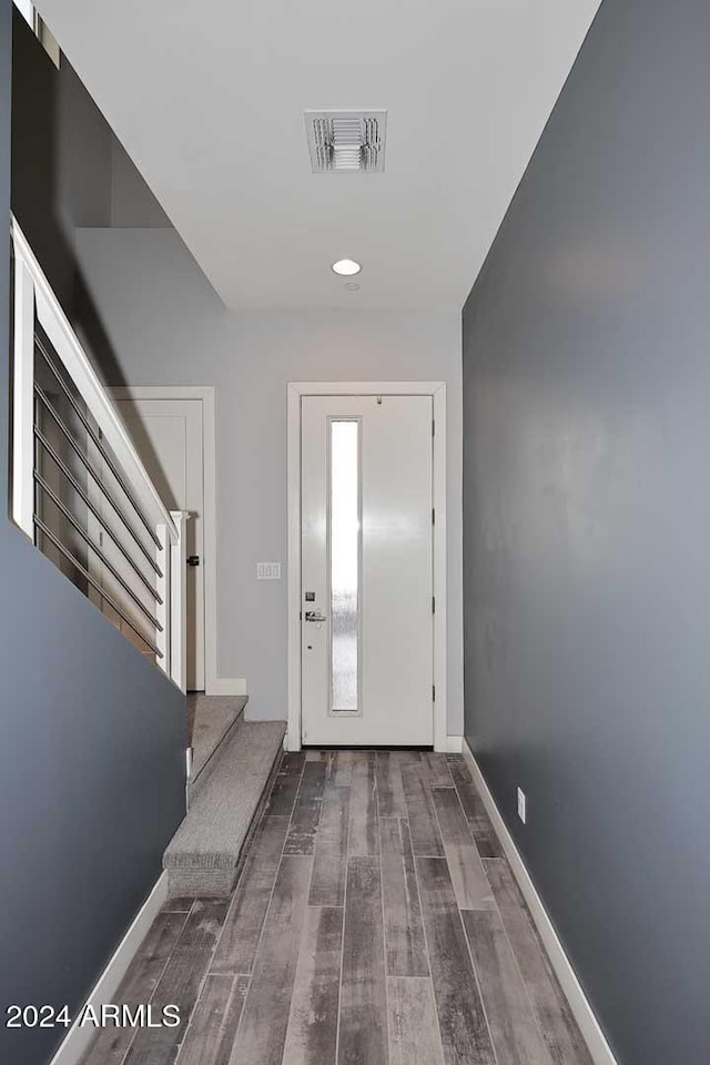 entryway with hardwood / wood-style floors