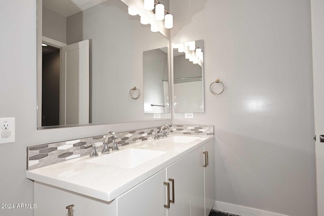 bathroom with vanity and backsplash