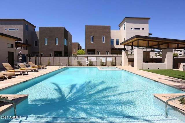 view of swimming pool featuring a patio area