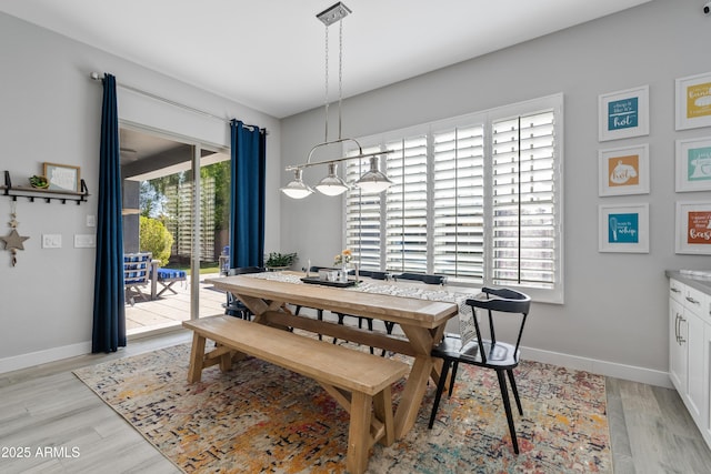 dining space featuring light wood-type flooring