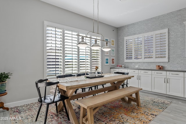 dining space with light hardwood / wood-style floors