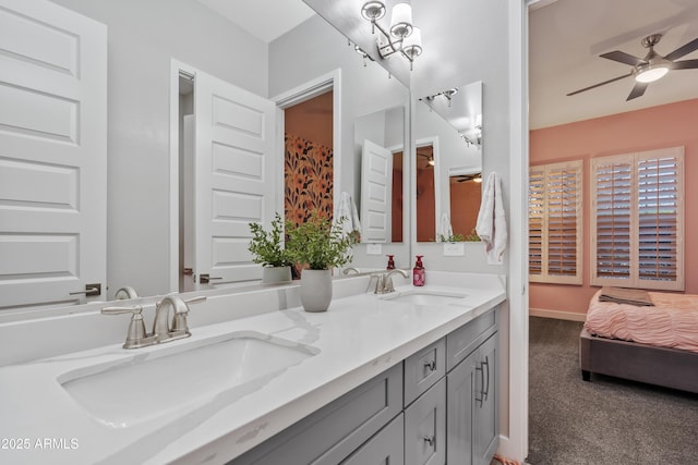 bathroom featuring ceiling fan and vanity