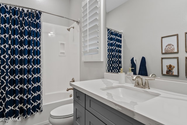 full bathroom with shower / tub combo with curtain, vanity, and toilet